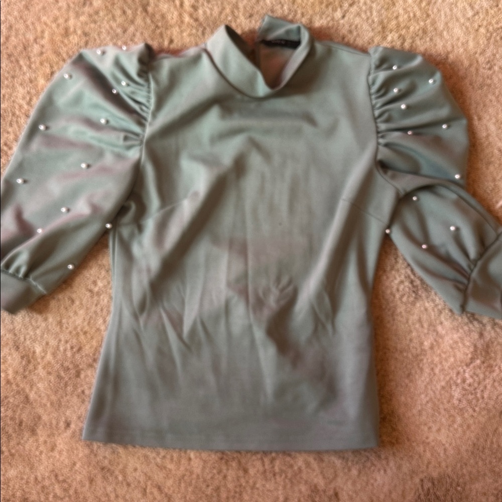 Elegant Green Top with Pearl Accents- small makeup stain